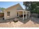 The home's beautiful backyard features a covered patio and fire pit at 123 Stoneforest Dr, Woodstock, GA 30189