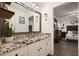 Bathroom showcasing granite countertop and open view to the primary bedroom at 123 Stoneforest Dr, Woodstock, GA 30189
