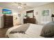 Bedroom features dark wood furniture, and a ceiling fan at 123 Stoneforest Dr, Woodstock, GA 30189