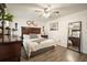 Bedroom showcasing dark wood furniture and a ceiling fan at 123 Stoneforest Dr, Woodstock, GA 30189