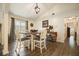 Charming dining area featuring a round table, natural light, and wood-look floors at 123 Stoneforest Dr, Woodstock, GA 30189