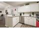 Bright and tidy kitchen featuring white cabinets, stainless steel appliances and granite counters at 123 Stoneforest Dr, Woodstock, GA 30189