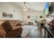 Inviting living room with vaulted ceilings, a cozy fireplace, and a comfortable leather sectional at 123 Stoneforest Dr, Woodstock, GA 30189