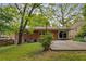 A well-maintained backyard with a brick home and a lush lawn at 1460 Briarcliff Ne Rd, Atlanta, GA 30306