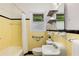 Bright bathroom featuring yellow tile, a shower-tub combo, and stylish fixtures at 1460 Briarcliff Ne Rd, Atlanta, GA 30306