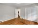 Bedroom featuring hardwood floors, a closet, and a doorway leading to another room at 1460 Briarcliff Ne Rd, Atlanta, GA 30306