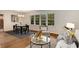 Open-concept with dining area featuring hardwood floors, a modern chandelier, and large windows at 1460 Briarcliff Ne Rd, Atlanta, GA 30306