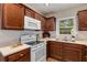 Well-lit kitchen with updated appliances and solid wood cabinets, offering ample storage at 1460 Briarcliff Ne Rd, Atlanta, GA 30306