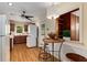 Kitchen features wood floors and a view to an adjacent room through a pass-through window at 1460 Briarcliff Ne Rd, Atlanta, GA 30306