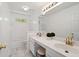 Bright bathroom with white tile, double vanity, and modern fixtures at 1820 Lyon Sw Ave, Atlanta, GA 30331