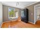 Bedroom with hardwood floors, lots of light, and space for a sitting area at 1820 Lyon Sw Ave, Atlanta, GA 30331