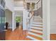Bright foyer boasts hardwood floors, staircase, and high ceilings, creating a grand entrance to the home at 1820 Lyon Sw Ave, Atlanta, GA 30331