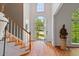 Grand foyer with arched window, a front door view, and hardwood flooring welcomes you inside this beautiful home at 1820 Lyon Sw Ave, Atlanta, GA 30331