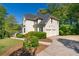 View of the rear of the house, highlighting an attached garage with an extra-long driveway at 1820 Lyon Sw Ave, Atlanta, GA 30331