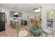 Open kitchen with island, gray cabinets, stainless appliances, and view to the living room at 1820 Lyon Sw Ave, Atlanta, GA 30331