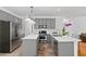 Modern kitchen with gray cabinets, stainless steel appliances, and white countertops at 1820 Lyon Sw Ave, Atlanta, GA 30331