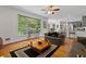 Open concept living room boasts hardwood floors, large windows, and a seamless flow to the kitchen at 1820 Lyon Sw Ave, Atlanta, GA 30331
