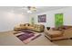 The living room offers neutral carpet, a painting, and furniture at 1820 Lyon Sw Ave, Atlanta, GA 30331