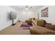 The living room offers neutral carpet, furniture, a painting, and a tv at 1820 Lyon Sw Ave, Atlanta, GA 30331