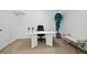 This home office offers a desk, a chair, and a plant for decor at 1820 Lyon Sw Ave, Atlanta, GA 30331
