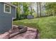 Charming home sits on a spacious lot with a shed and a lush green backdrop of mature trees at 214 Adeline Nw Ave, Atlanta, GA 30314