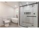 Bathroom with toilet, soaking tub, and glass enclosed shower at 214 Adeline Nw Ave, Atlanta, GA 30314