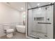 Elegant bathroom featuring a modern glass shower, standalone tub, and tile surround at 214 Adeline Nw Ave, Atlanta, GA 30314