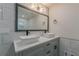Bathroom with a dual sink vanity, modern fixtures, and tile backsplash at 214 Adeline Nw Ave, Atlanta, GA 30314