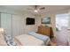 Bedroom with hardwood floors, a ceiling fan, and a mounted TV at 214 Adeline Nw Ave, Atlanta, GA 30314