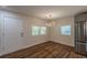 Well-lit dining area with hard wood floors and modern light fixture at 214 Adeline Nw Ave, Atlanta, GA 30314