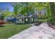 Charming two-story home with a covered front porch and lush landscaping at 214 Adeline Nw Ave, Atlanta, GA 30314