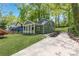 Charming home with a covered front porch, well-manicured lawn, and a long driveway at 214 Adeline Nw Ave, Atlanta, GA 30314