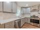 Modern kitchen boasts stainless steel appliances, quartz countertops, and subway tile backsplash at 214 Adeline Nw Ave, Atlanta, GA 30314