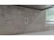 Close-up of a kitchen backsplash with grey stone tiles and modern window at 214 Adeline Nw Ave, Atlanta, GA 30314