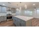 Well-lit kitchen featuring stainless steel appliances, an island, and an open-concept layout at 214 Adeline Nw Ave, Atlanta, GA 30314