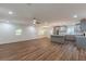 Spacious and open living area featuring a kitchen with stainless steel appliances and a ceiling fan at 214 Adeline Nw Ave, Atlanta, GA 30314
