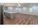 Bright open-concept living space with hardwood floors seamlessly connects to a modern kitchen at 214 Adeline Nw Ave, Atlanta, GA 30314