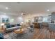 Bright, open-concept living space with hardwood floors seamlessly connects to a modern kitchen at 214 Adeline Nw Ave, Atlanta, GA 30314