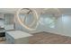 Open-concept living space featuring modern lighting, wood floors, and a kitchen island at 214 Adeline Nw Ave, Atlanta, GA 30314