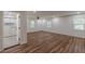 Spacious living area with wood-look floors, large windows and ensuite bathroom at 214 Adeline Nw Ave, Atlanta, GA 30314