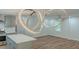 Open floor plan featuring modern light fixtures, hardwood floors, and stainless steel appliances at 214 Adeline Nw Ave, Atlanta, GA 30314