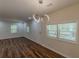 Living area featuring a modern light fixture, hardwood floors, and lots of natural light at 214 Adeline Nw Ave, Atlanta, GA 30314