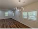 Bright living room featuring hardwood floors, modern lighting, and ample natural light at 214 Adeline Nw Ave, Atlanta, GA 30314