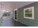 Covered porch with a view of the home's exterior, showcasing the entrance and a window at 214 Adeline Nw Ave, Atlanta, GA 30314