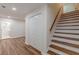Staircase with wood stairs and white risers leads to the upper level at 214 Adeline Nw Ave, Atlanta, GA 30314