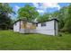 White home exterior with a charming wooden deck, surrounded by lush green lawn at 2554 Gordon Se Cir, Smyrna, GA 30080