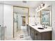Bathroom features a double sink vanity and a doorway to a stylish glass shower at 2554 Gordon Se Cir, Smyrna, GA 30080