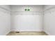 Walk-in closet with wire shelving, wood-look floors, and a small window at 2554 Gordon Se Cir, Smyrna, GA 30080