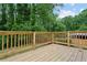 Spacious wooden deck overlooking a lush green backyard with plenty of shade at 2554 Gordon Se Cir, Smyrna, GA 30080