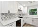 Beautiful kitchen with new cabinets, granite countertops, tile backsplash, and updated appliances at 2554 Gordon Se Cir, Smyrna, GA 30080